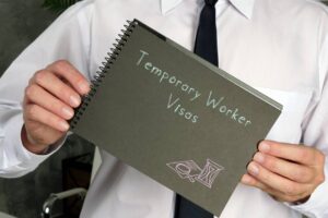 temporary worker visas with inscription on the piece of paper